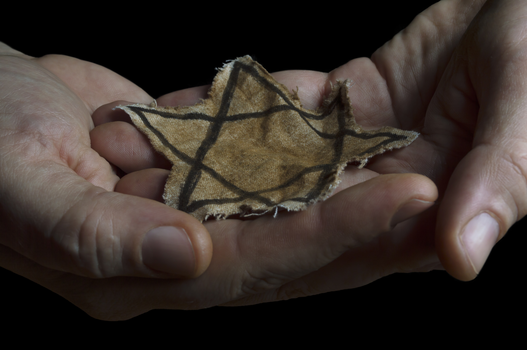 Jewish badge in the hands of a man
