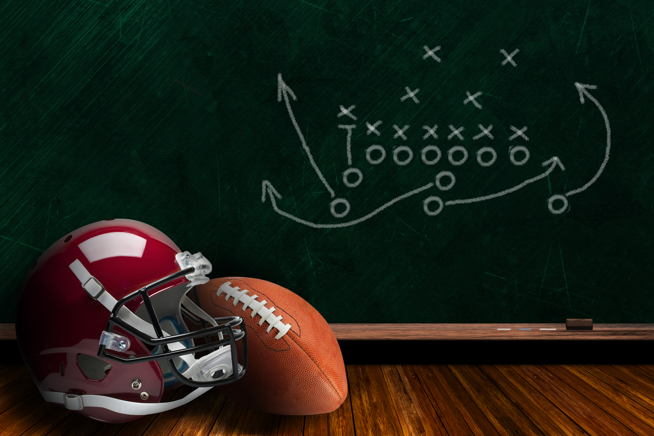 Football Equipment and Chalk Board Play Strategy Background