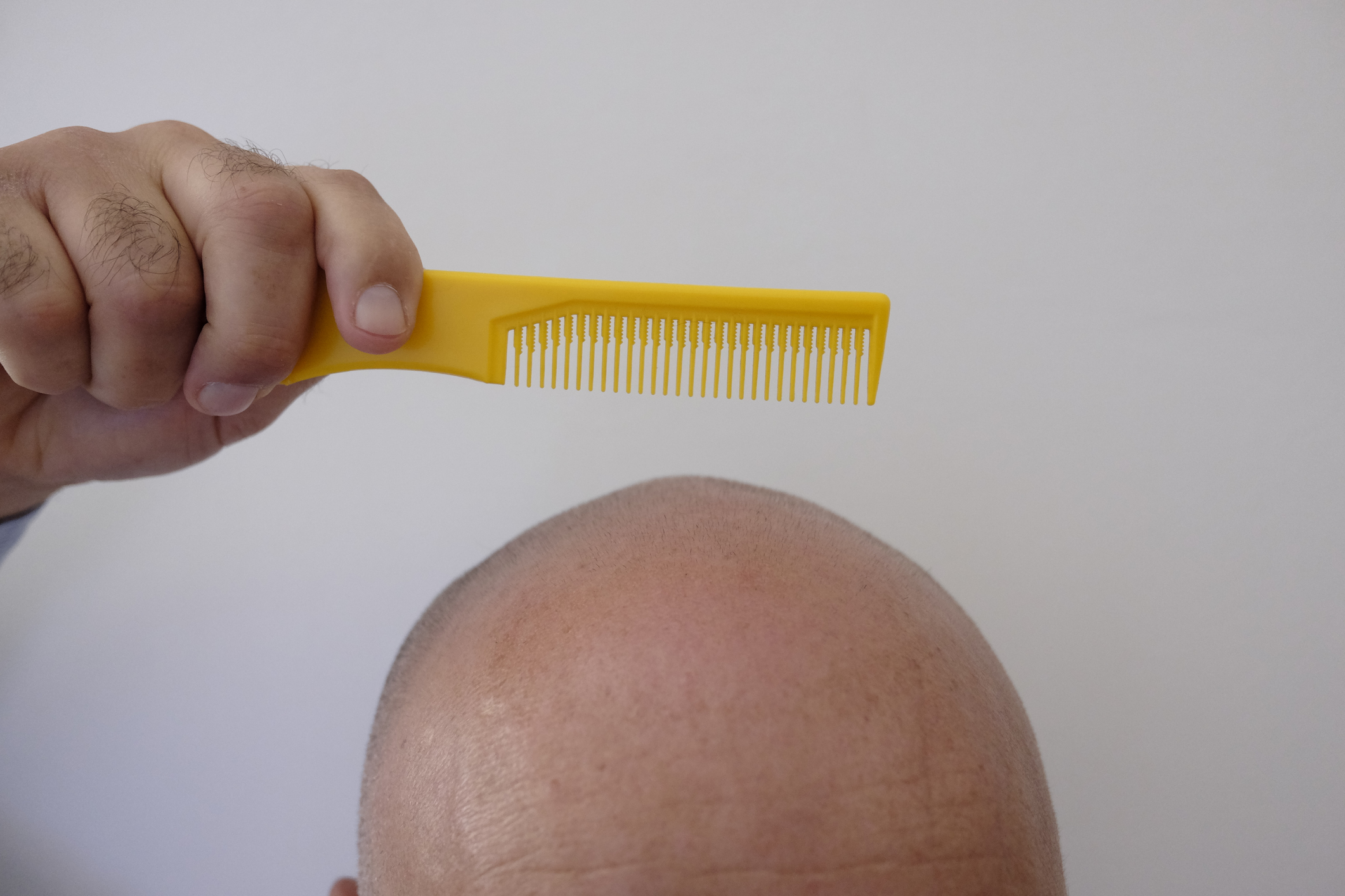 bald man with comb